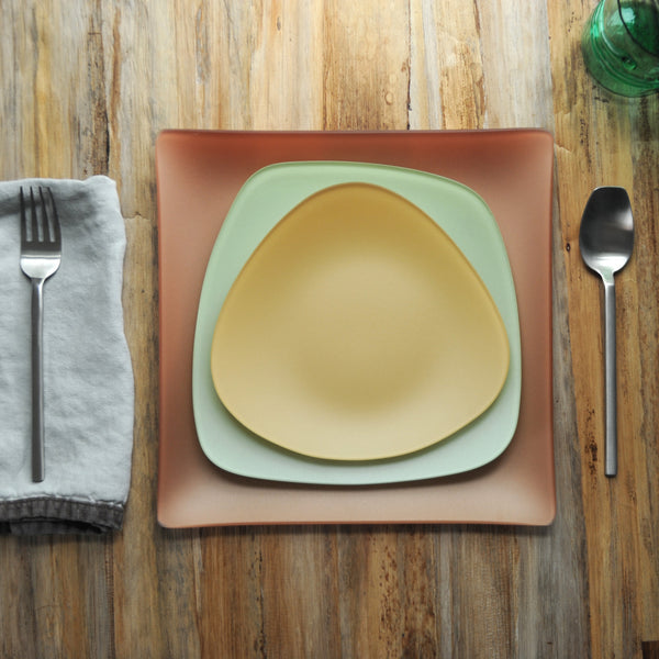 Seaglass place setting with gold triangle plate